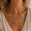 20F70D15-3156-47BD-A66F-5B9F719AE428 collier porté grenat vert et rose